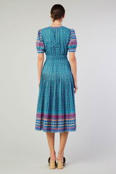 This split-neck midi dress serves as the canvas for a harmonious meetup of prints. Framed by a geometric border, the pleated number has an abstract floral motif that's a delight for the modern bohemian. •Split neckline •Lined •Short sleeves •Elasticized waist •Pleated skirt •Mid-length hem DIMENSIONS •Standard: 49.25" Length Item number 2490244 100% Cotton Lining 75% Rayon 25% Polyester Dry cleanItem number 2490244 Bohemian Ikat Print Dress For Spring, Bohemian Spring Dresses With Ikat Print, Bohemian Blue Midi Dress With Vibrant Print, Bohemian Pleated Midi Dress, Summer Midi Dress With Ikat Print, Bohemian Ikat Print Spring Dresses, Summer Ikat Print Midi Dress, Spring Ikat Print Patterned Dress, Spring Blue Ikat Print Dress