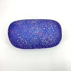 a blue eyeglass case with red, white and blue sprinkles on it