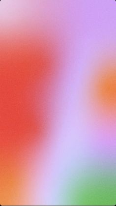 an abstract blurry background with red, green, blue and yellow colors in the center