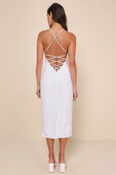 Make a toast to how sweet and sensational you look in the Lulus Celebratory Beauty White Mesh Embroidered Lace-Up Midi Dress! Sheer mesh (atop a white knit liner) boasts intricate floral embroidery, paired with sparkling clear sequins, as it falls from long straps that lace up the open-back design. A straight neckline and a fitted bodice with pleated details sit atop a high, fitted waist. Figure-skimming column skirt finishes at a chic midi hem with a kick pleat at the back. Hidden back zipper/c White Midi Length Dress With Lace-up Back, White Midi-length Dress With Lace-up Back, White Lace-up Back Midi Dress For Summer, White Midi Dress With Lace-up Back, Fitted White Midi Dress With Delicate Lace, White Lace Crochet Midi Dress, White Midi-length Embroidered Dress With Lace Trim, Column Skirt, Kick Pleat