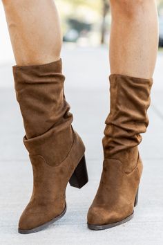 Details Brown boots Suede fabric ruched fabric, slouchy fit Rounded pointed toe with block heel and taller length Pair these cute boots with a sweater dress Heel Height: 3" Shaft height 6" Circumference 11" Material and Care Made of all man made materials. Dry sponge clean. Colors will vary from different devices. If you are returning a pair of shoes: Shoe boxes must be encased in another box for shipping to protect the items. If you send shoes back with stickers and return labels directly on th Slouchy Suede Boots, Brown Booties, Cute Boutiques, Suede Fabric, Cute Boots, Sponge Cleaning, Suede Booties, Cute Woman, Suede Boots