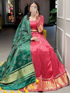 Precise magnificence comes out from your dressing design with this red color gaji silk lehenga choli. This stunning attire is an excellent lagdi patta work. This incredible red color lehenga comes with a similar color blouse designed with lagdi patta work featuring a green color dupatta in gaji silk material with bandhani-patola and pichwai digital print work also comes with both side tassels. This red traditional gaji silk lehenga is stitched up to 42 inches and comes with fully stitched 1.20-m Red Color Lehenga, Dressing Design, Red Lehenga Choli, Bandhani Dupatta, Bridesmaid Lehenga, Silk Lehenga Choli, Party Wear Lehenga Choli, Choli Designs, Red Lehenga