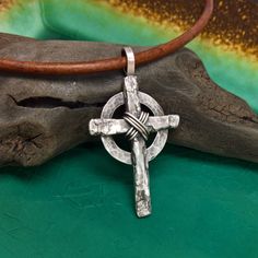 "This Rustic Cross is completely Hand Crafted by Me in my Studio using Natural Tree Bark! The Cross Pendant is available in a Large (approx. 1 1/2\" x 1 1/16\") or Small size (approx. 1 1/4\" x 7/8\"); the bail adds 1/4\" to the length. The pendant hangs on a 3mm Naturally Dyed Leather Cord with hand forged Clasp components. The Celtic Ring comes in your choice of Bronze, Copper, or Sterling Silver. A Wire Wrap is added to the center of the cross in the same metal type as the Celtic Ring, or lea Rustic Cross, Mens Cross Necklace, Mens Crosses, Celtic Rings, Celtic Cross, Tree Bark, Sterling Silver Mens, Cross Jewelry, Metal Clay