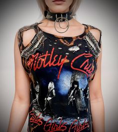 THE STITCHES Distressed Rock collection - This Mötley Crüe T-shirt is a handmade bleached crop top/t-shirt made with a brand new officially licensed band shirt. - Distressed Mötley Crüe  crop top/shirt - Safety pin unisex hand-made crop/tee - Material: Bleached cotton Measurements: Small size (Ready to ship) M, L, XL, XXL Sizes (Made to order: 10 working days process for made to order) Width (armpit to armpit)  S : 18 Inches  M: 20 Inches L: 22 Inches aXL: 24 Inches XXL: 26 Inches 3XL: 28 Inches For made-to-order tee: Due to all of the t-shirts being handmade, please understand that the bleach on each item is uniquely placed. - Length (top of collar to bottom) S: 25 inches For made-to-order, you can provide me with the length you prefer Care instructions: - This is a distressed item and wi Rock Style Festival Crew Neck Top, Rock Style Crew Neck Top For Festivals, Rock Style Festival Top With Crew Neck, Distressed Punk T-shirt, Edgy Acid Wash T-shirt For Alternative Fashion, Edgy Fan Merchandise Tops, Edgy Graphic Print Tops For Festivals, Black Rock Style T-shirt For Festival, Edgy Cotton Tops For Biker Events