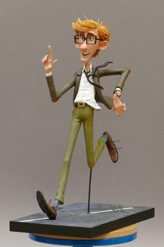 a figurine of a man with glasses on top of a table