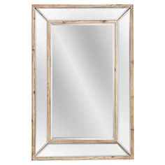 a mirror that is sitting on top of a white wall and has a wooden frame around it