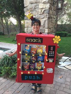 a woman is dressed up as a snack vending machine