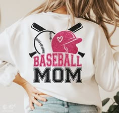 a women's baseball mom sweatshirt with pink glitter letters and bats on the back