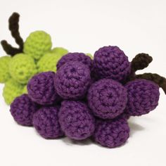 small crocheted grapes sitting next to each other