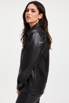 Women's Full Sleeve Leather Trucker Shirt In Black Experience the fusion of sophistication and rugged charm with our women's leather trucker shirt. Crafted from premium cowhide with a semi-aniline finish, it boasts a soft viscose lining for ultimate comfort. Featuring snap button closures, a turn-down collar, and button cuffs, this black trucker leather shirt is detailed with two breast pockets, blending functionality with timeless style. Outer Shell: Genuine Leather Leather Type: Cowhide Leather Finish: Semi-aniline Inner Shell: Viscose Lining Closure Style: Snap Buttons Collar Style: Turn Down Cuff Style: Button Sleeves: Full Outside Pockets: Two Breast Pockets Color: Black Leather Shorts Women, Short Leather Skirts, Black Experience, Trucker Shirts, Leather Jumpsuit, Utility Shirt, Studded Jacket, Shearling Vest, Distressed Jacket