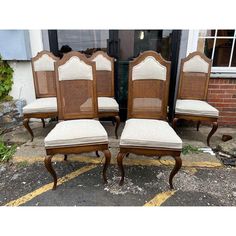 set of four chairs with cane back and upholstered seats