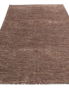 a brown rug with fringes on the top and bottom, against a white background