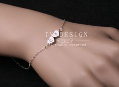 Reversible Heart initial BraceletSterling silver by tydesign, $27.00 Sterling Silver Name Bracelet With Heart Charm For Gift, Personalized Sterling Silver Heart Friendship Bracelet, Stainless Steel Heart Charm Jewelry For Friendship, White Stainless Steel Jewelry With Heart Charm, Silver Heart Bracelets For Best Friend Gift, Heart-shaped Silver Bracelets For Best Friend Gift, Silver Heart Bracelet For Best Friend On Mother's Day, Silver Heart Bracelet For Best Friend On Valentine's Day, Hypoallergenic Sterling Silver Heart Bracelet For Friendship