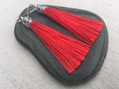 "Chic red tassel earrings! They would add a pop of color to any outfit for any occasion. Dress them up or down. They are timeless and versatile. They are lightweight, fun and unique! The tassels measure 2 1/8\" long by 1/4\" wide. They hang from simple silver ear wire hooks. Overall drop length is about 2 1/4\". Metal is allergy free plated silver. These are my latest creation! I have them available in many colors! Find them all under the category tassel earrings in my shop. Thanks for stopping Red Tasseled Jewelry As A Gift, Red Tasseled Jewelry For Gift, Red Fringe Tassel Earrings As Gift, Red Fringe Tassel Earrings For Gift, Red Tassel Earrings With Fringe For Gift, Red Dangle Tassel Earrings As Gift, Red Tassel Earrings For Gift, Red Dangle Tassel Earrings For Gift, Red Tassel Drop Earrings Gift