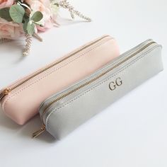 This cute Mini Accessory Case would make a lovely gift for a loved one, or even yourself!  It's perfect for keeping all your little bits safe in your bag. You could even use it as a pencil case or mini make up bag.  PERSONALISATION Each item can be personalised with either a name/role or the persons initials (in either gold, rose gold, silver, white or black). We also have 6 designs to choose from, as shown in the product photo's.  We will use gold text unless otherwise specified in the personalisation box. Please do get in touch if you have any questions and we will be happy to help. SPECIFICATION & FEATURES Available in Black, Black/Black, Grey or Pink (as shown in the photos, this is more of a peachy pink than baby pink) Dimensions: 22 x 5.5 x 4.5 cm 100% PU Leather Saffiano fine grain Pink Bags With Pen Slots For Personal Use, Cute Rectangular Cosmetic Bag For Gift, Cute Rectangular Cosmetic Bag Gift, Gift Cosmetic Pouch With Pen Slots, Portable Rectangular Cosmetic Bag Gift, Rectangular Portable Cosmetic Bag Gift, Gift Cosmetic Bag With Pen Holders, Cute Portable Pencil Case For Gift, Portable Pouch Pencil Case As Gift