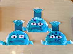 three paper plates shaped like angry birds with googly eyes and beaks on them