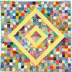 a colorful patchwork quilt with squares on it