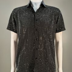 Step into the spotlight with our handmade, sophisticated Silver on Black Short Sleeve Dress Shirt. This true masterpiece embodies elegance and is designed for those who demand attention. Perfectly blending beauty and comfort, it is adorned with a myriad of silver rhinestones that sparkle brilliantly, defying capture by mere photos or videos. Dive into a world where fashion meets functionality, and let this splendid Dress Shirt with short sleeves elevate your style to new heights. Black Embellished Shirt For Party, Elegant Black Embellished Shirt, Elegant Party Shirt With Rhinestones, Luxury Black Party Shirt, Luxury Tops For Summer Night Out, Formal Fitted Embellished Shirt, Embellished Fitted Formal Shirt, Formal Fitted Rhinestone Tops, Formal Fitted Tops With Rhinestones