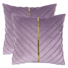 two purple velvet pillows with gold zippers