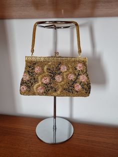 Description:  Vintage Gold, Pink and Black Beaded Handbag.Removable handle, Gold pink and black intricate floral beaded pattern, Lined, Made in Hong KongMeasurements:Height: 15cm, Width: 25cm, Bag to Strap: 14cm Vintage Appreciation Society: Online and Instore @vintageappreciationsociety and @handbagappreciationsociety Traditional Evening Bags With Sequins, Black Floral Top, Gold Handbags, Motifs Perler, Beaded Handbag, Antique Roses, Black Beads, Black Floral, Vintage Gold