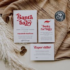 three different types of baby announcement cards on a table with buttons and coins next to them