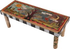 an artisticly painted wooden bench with birds and trees on the top, sitting in front of a white background