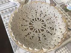 a large white bowl sitting on top of a table