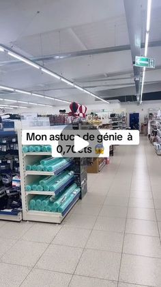 an empty grocery store with items for sale in the aisles and on the shelves, there is a sign that says mon astu de genie