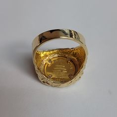 ♥ Coin Information ♥Type: CoinMetal Content: 1/20OZCountry: ChinaDenomination: 5 YuanComposition: .999 GoldYear: 1991♥ Ring Information ♥Details: Nugget Band Material: 14k Yellow GoldDimensions: 19mm x 20mm Weight: 12 Grams Size: 9.75Size can be adjusted – one size up/down is $50 two sizes up/down is $60. Once ring is adjusted it is final sale. Collectible 14k Gold Diamond Ring, Collectible Luxury Gold Rings, Antique Yellow Gold Rings For Commemoration, Elegant Gold Ring For Commemoration, Heirloom Style Yellow Gold Ring For Commemoration, Yellow Gold Hallmarked Engraved Ring For Commemoration, Gold Signet Ring With Prong Setting, Hallmarked Yellow Gold Engraved Collectible Ring, Gold Jewelry With Certificate Of Authenticity For Anniversary