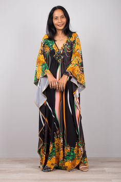 "Boho summer kaftan, Floral dress, Boho Kaftan Dress, Maxi Dress, Long loose fit dress, Kaftan, caftan, frock dress PRODUCT SIZE : One Size Fits Most * Chest : free up to 32 - 58\" * Waist : free up to 58\" * Hips : free up to 56\" * Length : 59\" from shoulder to hem, measured laying flat - when hanging it measures up to 60\" ) * Sleeve length : 24\" MATERIAL * ITY Polyester * No lining NOTE : * Model chest : 32\", waist : 24\" hips : 35\" * Combined Height is 5\"6 > I'm 5\"2 (158cm) and I'm Festive Floral Print Floor-length Kaftan, Floral Print V-neck Kaftan For Beach, Silk Kaftan With Floral Print And V-neck, Silk Floral Print Floor-length Kaftan, Bohemian Floral Print Floor-length Kaftan, Kaftan Top, Frock Dress, Boho Floral Dress, Loose Fitting Dresses