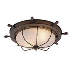 a ceiling light that is on top of a white wall with an iron frame and glass shade