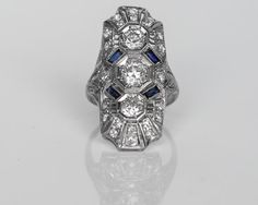 Circa 1930 - Platinum Art Deco Shield Ring with Old European Cut Diamonds & Sapphires - 1.20cttw - VEG#396 Collectible Art Deco Platinum Sapphire Ring, Art Deco Multi-stone Platinum Diamond Ring, Art Deco Gia Certified Collectible Rings, Collectible Art Deco Gia Certified Rings, Classic Multi-stone Platinum Diamond Ring, Art Deco Platinum Multi-stone Rings, Art Deco Multi-stone Platinum Rings, Platinum Multi-stone Art Deco Rings, Art Deco Multi-stone Diamond Ring