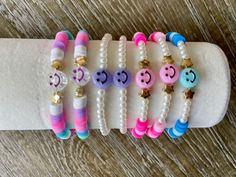 Beautiful, fun, happy bracelets.  Smiley Faces Theme.    Choose your perfect bracelet or stack today!  Listing is for one (1) bracelet. Please include personalization details in the personalization box if you would like it personalized.   Please specify the color or the symbols (if any) if different from the ones displayed. The standard adult size for all bracelets is approximately 6.75 inches. If you need a custom size, please include it in the personalization box. To measure your wrist, place a string around the wrist and measure it against a ruler.  *Standard size will be sent if no size is included in the personalization box*  These bracelets make great, fun gifts for birthdays, brides to be, bridesmaids, friends, party favors, baby showers, bachelorette parties, teachers, Mother's Day Quick Braids, Clay Bracelet, Diy Bracelet Designs, Summer Bracelets, Bangle Bracelets With Charms, Letter Beads, Cute Bracelets, Clay Beads, Bracelet Gift