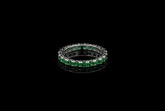 Elegant eternity wedding band ring featuring sparkling brilliant cut created emerald set all around the band totaling 2.50carat. Ring is crafted from solid 14k white gold with high polished finish. Our created diamonds are synthetic simulants that feature brighter D color , FL / VVS1 clarity and ideal cut making them visually indistinguishable from natural diamonds that cost thousands of dollars. We only use high quality solid gold/silver in our jewelry, WE DO NOT sell fake gold/silver jewelry. Classic Green Eternity Promise Ring, Classic Green Round Cut Eternity Band, Classic Green Eternity Band As A Gift, Green Round Cut Eternity Band For Formal Occasions, Classic Green Eternity Band, Classic Green Round Eternity Band, Green Eternity Band With Vvs Clarity In Round Shape, Round Emerald Eternity Band With Prong Setting, Formal Emerald Eternity Band