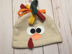 a turkey hat made out of felt on top of a wooden table