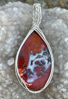 This unique Pendant has a combination of Red Jasper and Druzy Agate in Argentium Silver. Agate Jewelry With Polished Finish For Gifts, Polished Agate Jewelry As A Gift, Collectible Silver Wire Wrapped Jewelry, Unique Polished Silver Gemstones, Silver Carnelian Jewelry With Natural Stones, Silver Spiritual Jewelry With Carnelian, Silver Carnelian Gemstone Jewelry, Artisan Agate Jewelry With Polished Finish, Red Sterling Silver Jewelry With Large Stone