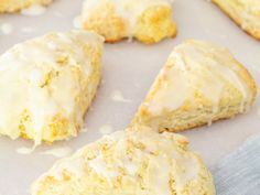 glazed scones are sitting on a baking sheet