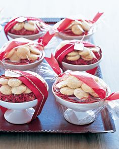 small bowls filled with cookies wrapped in red ribbon