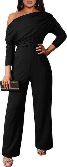 Indulge in luxury with our Black Draped Asymmetrical Jumpsuit. Featuring a unique and sophisticated draped design, this jumpsuit exudes elegance and exclusivity. The asymmetrical hem adds a touch of avant-garde to your look, making a bold fashion statement. Elevate your style with this premium piece. Polyester and Spandex. Women's casual jumpsuit is made of high quality elastic and soft fabrics, breathable and comfortable, stretchy and soft, lighweight. Brand Size Dress Bust Waist Hip XS 0-2 31-32.5'' 23-24'' 31-34" S 4--6 33-35'' 25-26'' 35-37" M 8--10 35-36'' 27-28'' 38-39" L 12--14 38-40'' 29-31'' 40-42" XL 14-16 40-42'' 33.5-36'' 44-46" 2XL 18-20 42-44'' 37-40'' 47-50" 3XL 22-24 44-46'' 41-46'' 51-55" 4XL 26-28 46-48'' 47-50'' 56-60" Elegant Long Sleeve Jumpsuits And Rompers For Evening, Solid Color Wide Leg Jumpsuits For Evening, Wide Leg Jumpsuits And Rompers For Evening, Solid Wide Leg Jumpsuits And Rompers For Evening, Chic Solid Color Party Pantsuit, Elegant Solid Color Pantsuit For Date Night, Elegant Jumpsuits And Rompers For Night Out, Elegant Strapless Wide Leg Jumpsuit For Formal Occasions, Elegant Strapless Wide Leg Jumpsuit For Formal Events