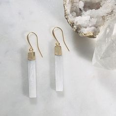 Crystal healing earrings with selenite for protecting against negativity White Moonstone Earrings For Daily Wear, Minimalist Natural Stone Earrings, White Moonstone Earrings, Minimalist White Moonstone Jewelry, Spiritual White Earrings For Gift, White Spiritual Dangle Earrings, Spiritual White Dangle Earrings, White Moonstone Earrings With Natural Stones, White Earrings With Natural Stones For Gift