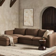 a living room with a large sectional couch