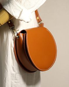 Overview: Design: Brown Leather Round Bag Handmade Women Circle Bag Cute Round Purse Round Crossbody BagIn Stock: 3-5 days For MakingInclude: A Shoulder BagCustom: NoLeather: CowhideMeasures: L 19cm x W 6cm x H 16cmWeight: 0.33 kgSlots: 1 main slot,Accessories(option): NoneStyle: Brown Leather Round Bag Handmade Women Circle Bag Cute Round Purse Round Crossbody BagVery durable (At least 5 Years) and it should last a life time Note: Each Item will have very slight variances to the pictured Item, Shooting Bags, Women Circle, Overview Design, Round Purse, Red Crossbody Bag, Circle Bag, Women's Circle, Luxury Crossbody, Side Bag