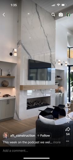 a living room filled with furniture and a flat screen tv mounted on the wall above a fireplace