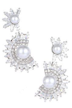 Elevate your elegance with our Floral Rhinestone Pearl Earrings. These exquisite earrings feature a captivating combination of floral motifs, sparkling rhinestones, and lustrous pearls, creating a timeless and charming accessory. Crafted with high-quality materials, they not only enhance your allure but also add a touch of sophistication to any look. Perfect for weddings, cocktail parties, or a romantic night out, these earrings are the ideal choice to make a statement and shine with grace. Silver Pearl Crystal Earrings For Evening, Glamorous Crystal Pearl Earrings For Evening, Glamorous Silver Crystal Pearl Earrings, Party Crystal Earrings With Pearl Drop, Silver Pearl Earrings For Party, Glamorous Pearl Earrings For Party, Party Pearl Drop Crystal Earrings In Cubic Zirconia, Party Crystal Earrings With Pearl Drop And Cubic Zirconia, Sparkling Cubic Zirconia Pearl Earrings For Party