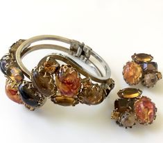 Vintage D&E Juliana Delizza & Elster clamper bracelet & clip on earrings set, bronze Sabrina cabochon stones in gold tone metal, simply stunning Bracelet Clip, Open Backs, Bracelet Earring Set, Glass Jewelry, Gold Tone Metal, Earrings Set, Clip On, Prong Setting, Costume Jewelry