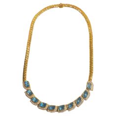 This wonderful piece is a neo- vintage and has never been worn. This beautiful piece is crafted in Thailand using 18K solid yellow gold. The piece is adorned with 10 gorgeous natural mix cut blue topaz and various 90 pave of good quality round pave diamonds. A wonderful and easy for the eye topaz piece to add to your grand jewelry box. Easy to wear yet elegant and lively cocktail piece- Perfect for wear on any special occasions. Product Details: Metal: 18k Solid Gold Metal Color: Yellow Gold Tot Luxury Topaz Necklace With Diamond Accents, Formal Topaz Necklace In Fine Jewelry Style, Formal Topaz Fine Jewelry Necklaces, Formal Topaz Fine Jewelry Necklace, Luxury Yellow Gold Necklace With Blue Topaz, Luxury Blue Topaz Yellow Gold Necklace, Luxury Yellow Gold Blue Topaz Necklace, Luxury Gold Necklace With Blue Topaz, Diamond Chain Necklace