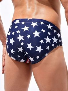 Show your patriotic spirit with our Americana Print Drawstring Waist Swim Brief. These swimwear bottoms feature an American-inspired print, combining stars and stripes in a stylish and eye-catching design. The drawstring waist ensures a customized and secure fit, allowing you to enjoy your water activities with ease. Specifications: Pattern Type: Geometric, Striped Details: Drawstring Type: Briefs Fabric: Medium Stretch Material: Fabric Composition: 82% Polyester, 18% Elastane Care Instructions: American Flag Print Bottoms For 4th Of July Beach, Patriotic Beach Bottoms With American Flag Print, Patriotic American Flag Print Beach Bottoms, Patriotic Beach Bottoms For Beach Season, 4th Of July Vacation Flag Print Bottoms, American Flag Print Bottoms For Beach Season, Blue Patriotic Swimwear With American Flag Print, Patriotic Blue Swimwear With American Flag Print, Patriotic Blue American Flag Print Swimwear