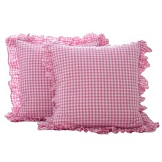 two pink gingham pillows with ruffled edges