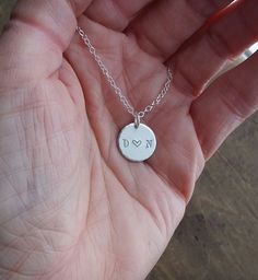 "{ i heart u } personalized Necklace Gift . soulmates couple initial necklace . gift for Valentine's day . Anniversary Necklace} for your special Valentines. for layering everyday . for the perfect personalized couples initial pendant on your Anniversary or a special Birthday {one} small 1/2\" circle pendant, hand stamped with two personalized initials separated by a single open heart . {one} delicate chain ~ you pick length & style for wearing alone or layering . letters left RAW for a soft White Hand Stamped Anniversary Necklaces, Sterling Silver Initials Jewelry For Wedding Gift, Stamped Jewelry For Valentine's Day Wedding, Personalized Round Pendant Initial Necklace For Wedding, Hand Stamped Round Pendant Necklace For Wedding, Wedding Hand Stamped Round Pendant Necklace, Minimalist White Jewelry For Anniversary Gift, Minimalist White Jewelry For Anniversary, Initials Round Pendant Charm Necklace For Wedding