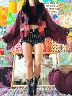 OOAK Patchwork Floral Fringe Coat MEASUREMENTS: SHOULDERS: up to 18.5" BUST: up to 44" LENGTH: 23" SLEEVE LENGTH: 23" LABEL SIZE: L/XL Fits like a Women's Large X-Large / Men's Medium-wide This One of a Kind Patchwork Fringe Floof Jacket is covered in beautiful & intricate fabrics & embellishments! The patchwork is a melody of metallics, velvets, & pashmina, with embroidery, lace, and other trims. The sleeves are pashmina fabric, with a luxurious thick coordinating fringe. The collar is black faux fur. The back of the jacket is black with pops of embroidered trim. This piece is super funky and fun. It will help you blend different shades of burgundy into one cohesive outfit, or add pops of color to your all black uniform 🫡 CONDITION: This piece is in good vintage condition. This piece was Fitted Red Outerwear For Festival, Vintage Fringe Jacket, Fringe Coat, Man Coat, Festival Coats, Fringe Coats, Vintage Fringe, Fringe Festival, Fabric Embellishment